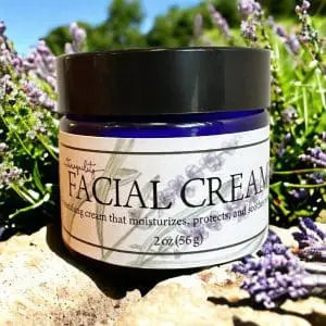 Jar of Facial cream outside with lavender